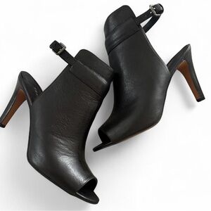 Franco Sarto black leather peep-toe ankle strap heels.